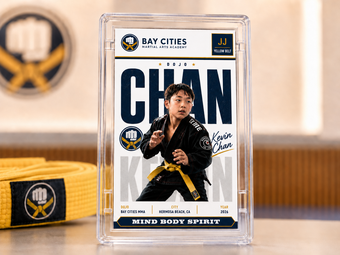 Close-up of a finished commemorative martial arts belt card, ready for the studio to present during a promotion ceremony or ship to families.